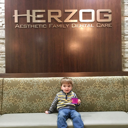 child waiting in the lobby of Herzog Aesthetic Family Dental Care